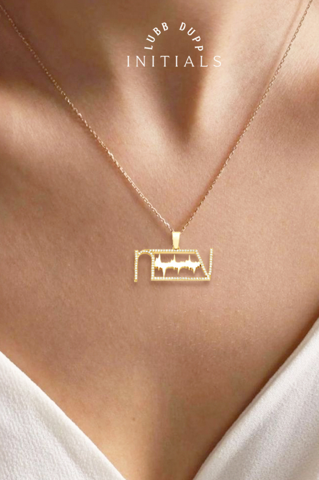 A chic gold-plated heartbeat initials necklace displayed on a model, showcasing its elegance.