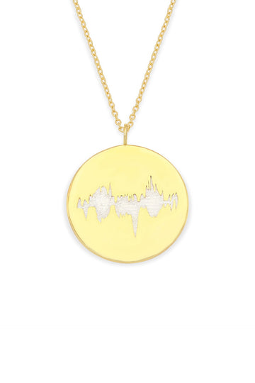 Gold Vermeil round pendant with a baby's heartbeat waveform engraved, paired with a gold chain.