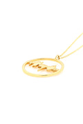 Side angle view of the gold Lubb-Dupp Necklet pendant, showcasing the intricate engraving of a baby’s heartbeat.