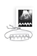 Silver Lubb-Dupp bracelet displayed alongside a sonogram image, representing a unique and meaningful keepsake.